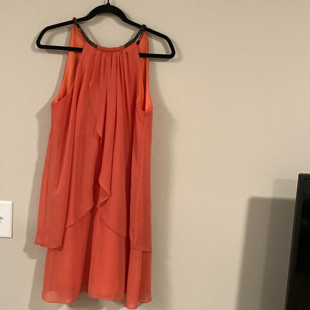 Brand new without tags size 10 tangerine colored dress! No defects!